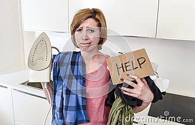 Angry woman or crazy busy housewife ironing shirt lazy at home k Stock Photo