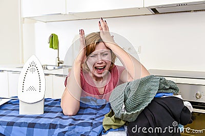 Angry woman or crazy busy housewife ironing shirt lazy at home k Stock Photo