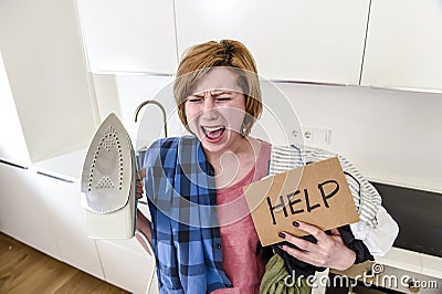 Angry woman or crazy busy housewife ironing shirt lazy at home k Stock Photo