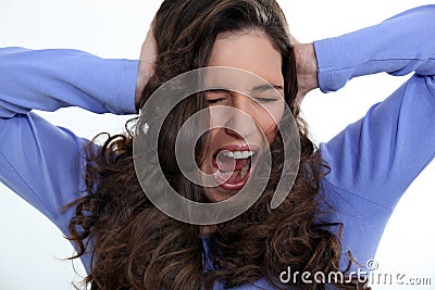 Angry woman with curly hair Stock Photo