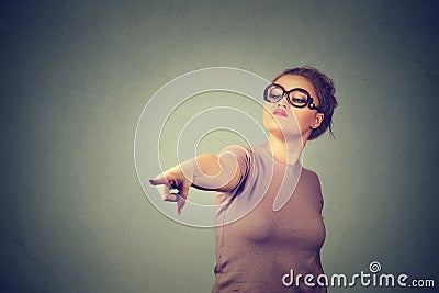 Angry woman pointing finger at camera. Negative human emotions Stock Photo
