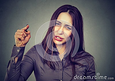 Angry woman pointing her finger accusing someone Stock Photo