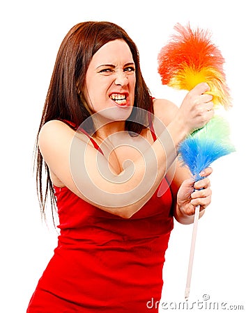 Angry woman in red shirt with whisk for house dust Stock Photo