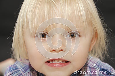 Angry young baby girl face Stock Photo