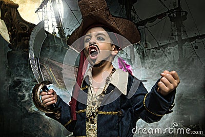 A angry young boy wearing a pirate costume. Stock Photo