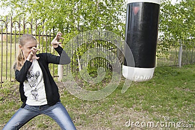 Angry young girl threatens to nail Boxing in the Park Stock Photo