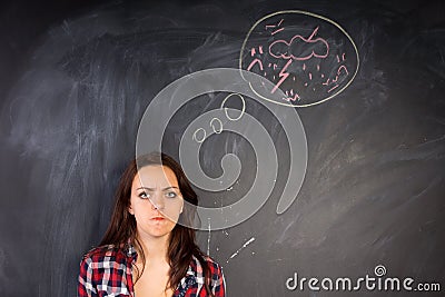 Angry young woman glaring at the camera Stock Photo