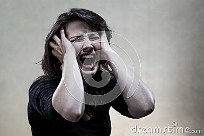 Angry young woman shouting Stock Photo