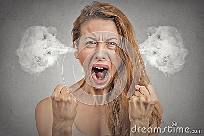 Angry young woman steam coming out of ears screaming Stock Photo
