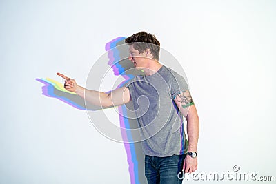 Angry youthful man pointing finger Stock Photo