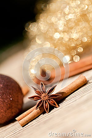 Anice cinnamon and bauble christmas decoration in gold Stock Photo