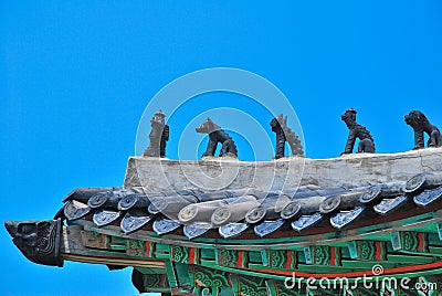 Animal statues on temple roof Stock Photo