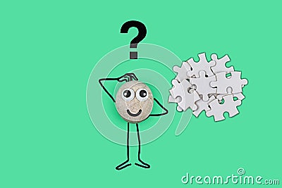 Animated character from a pebble with a happy face thinking through a solution to a problem in his mind Stock Photo