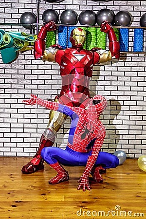 Animators iron man and spider-man in the fitness room Editorial Stock Photo