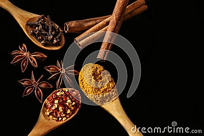 Anise, chilly, cinnamon and other spices - black background Stock Photo