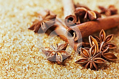 Anise star and cinnamon sticks on brown cane sugar Stock Photo