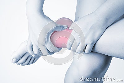 Ankle injury in humans .ankle pain,joint pains people medical, mono tone highlight at ankle Stock Photo