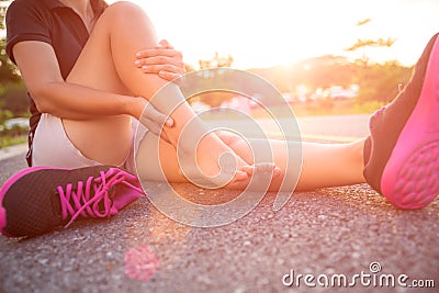 Ankle sprained. Young woman suffering from an ankle injury Stock Photo