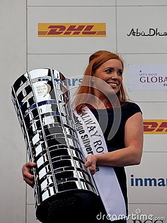 Anna de Paor holding the Volvo Ocean Race trophy Editorial Stock Photo
