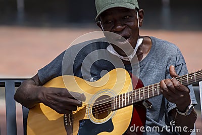 An elderly African American street musician Editorial Stock Photo