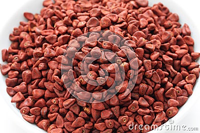 Annatto seeds, achiote seeds, bixa orellana seeds Stock Photo