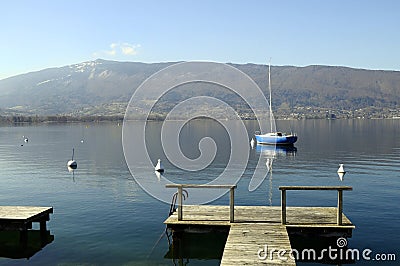 Annecy lake, quiet view with sailboat, Savoy, France Stock Photo