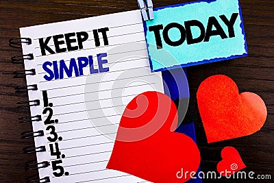 Announcement text showing Keep It Simple. Concept meaning Simplicity Easy Strategy Approach Principle written on notebook book pap Stock Photo