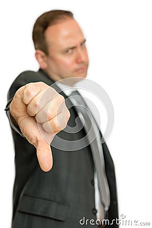 Annoyed, angry business man giving thumbs down Stock Photo