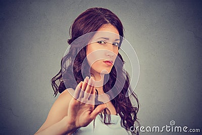 Annoyed angry woman with bad attitude giving talk to hand gesture Stock Photo