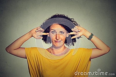 Annoyed angry woman plugging her ears with fingers doesn't want to listen Stock Photo