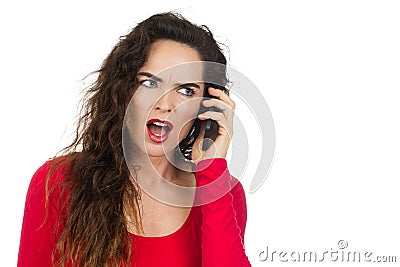 Annoyed angry woman talking on the phone Stock Photo