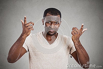 Annoyed angry young man asking what is your problem Stock Photo