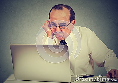 Annoyed bored man learning how to use computer Stock Photo