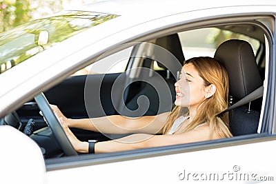 Annoyed female driver honking in traffic jam Stock Photo