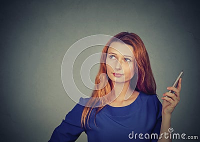 Annoyed and frustrated young woman on the phone Stock Photo