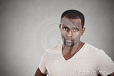 Annoyed unhappy young man looking at you camera Stock Photo