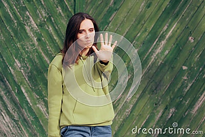 Annoyed Woman Making Stop Hand Gesture Stock Photo