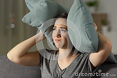 Annoyed woman suffering neighbour noise Stock Photo