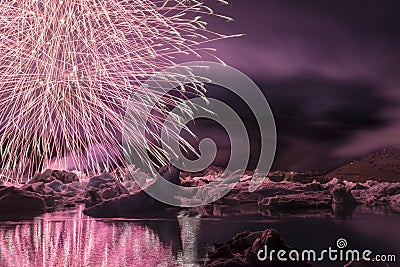 Annual firework show among icebergs at Ice lagoon Jokulsarlon, Iceland Stock Photo