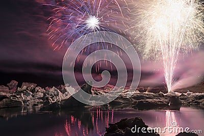 Annual firework show among icebergs at Ice lagoon Jokulsarlon, Iceland Stock Photo