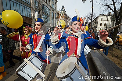 The annual holiday of April Fools` Day. Celebration in the city center. Costumed clowns, artists, mimes, fun, good mood. Many Editorial Stock Photo