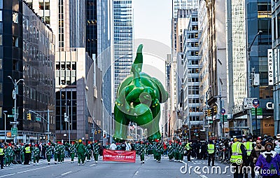 Annual Macy's Thanksgiving Parade on 6th Avenue. Baby Dino balloon Editorial Stock Photo