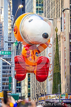 Annual Thanksgiving Macys parade with inflated Snoopy character Editorial Stock Photo