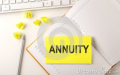 ANNUITY text on sticker on the diary with keyboard and pencil Stock Photo