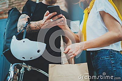 Anonimous Courier delivery food service at home. Man courier delivered the order no name bag with food Stock Photo