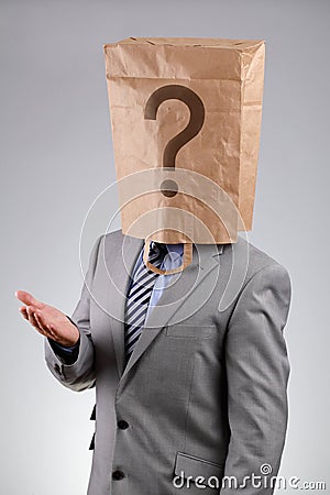 Anonymous businessman with paper bag on his head Stock Photo
