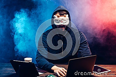 Anonymous hacker male commit a crime Stock Photo