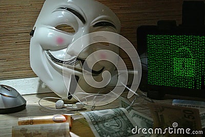 An anonymous hacker tries to crack the operating system`s protection Editorial Stock Photo