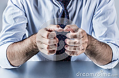 Anonymous hands of businessman showing, explaining, presenting or grasping something Stock Photo