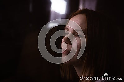 Anonymous, hidden image of a woman. A woman in the dark behind a cloth. Rethinking life, meditations, depressive psychological Stock Photo